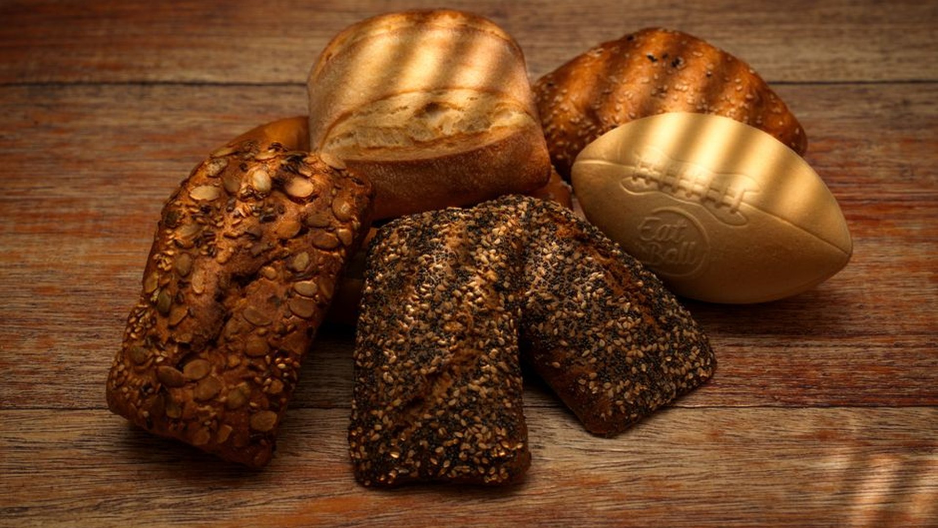 village bakery wooden counter rye roll hands folde